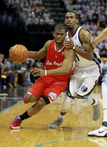 Chris Paul #3 of the Los Angeles Clippers dribbles the ball while defended by Mike Conley #11 of the Memphis Grizzlies the in Game One of the Western Conference Quarterfinals in the 2012 NBA Playoffs at FedExForum on April 29, 2012 in Memphis, Tennessee. Photo Courtesy of Andy Lyons/Getty Images North America/ AFP