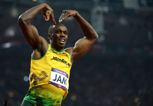 Jamaica's Usain Bolt celebrates after winning the men's 4X100 relay final at the athletics event of the London 2012 Olympic Games on August 11, 2012 in London. AFP PHOTO / OLIVIER MORIN