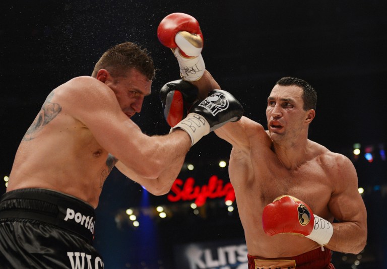 DOMINANT WIN. World heavyweight champion Wladimir Klitschko successfully defended his IBF, WBA and WBO titles on Saturday, November 10 with a unanimous points victory over Polish challenger Mariusz Wach. AFP.