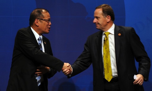 NZ PRIME MINISTER John Key (R) greets Aquino (L) during the APEC CEO Summit 2010 ahead of the APEC forum summit meeting in Yokohama, Japan on November 12, 2010. AFP PHOTO/INDRANIL MUKHERJEE