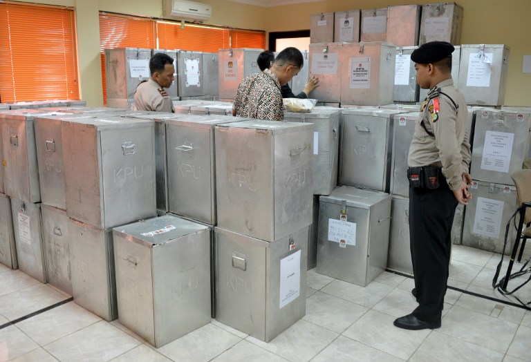 COUNTING VOTES. Ballot boxes being reading for national tabulation in Indonesia. Photo by AFP