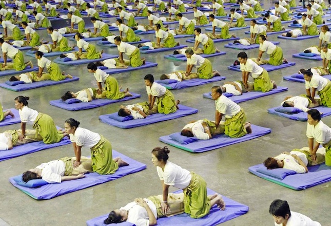 SOME 641 THAI MASSEURS AND MASSEUSES perform massages as they establish a new Guinness World Record for Thai massage at an indoor sport arena on the outskirts of Bangkok. AFP PHOTO