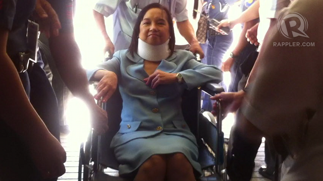 USING WHEELCHAIR. Former President Gloria Macapagal-Arroyo is often seen using a wheelchair, in this case during her arraignment at the Sandiganbayan in April. Photo by Paterno Esmaquel II