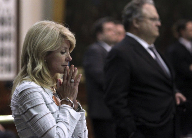 Texas State Senator Wendy Davis reacting after a third point of order halts her filibuster. Photo by EPA/LOUIS DELUCA / DALLAS MORNING NEWS