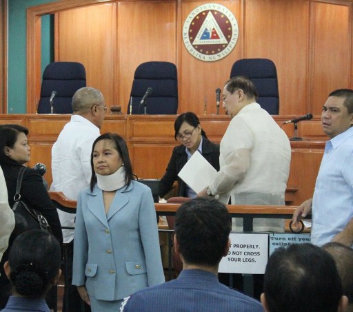 FAVORABLE RULING. The Sandiganbayan, before which former President Gloria Macapagal-Arroyo faces graft charges (in photo), rules in Mrs Arroyo's favor in connection with a plunder case. File photo from AFP