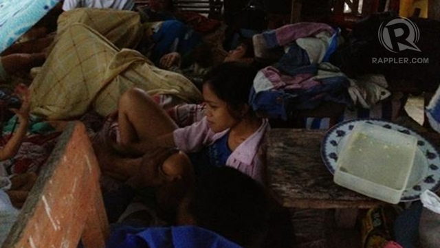 UNCERTAIN DAYS. Flood victims spend their nights and days in uncertainty amid continuous rain. Photo by Paterno Esmaquel II