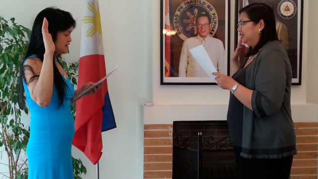 DUAL CITIZEN. April Iglupas takes her oath before Charmaine C. Aviquivil, Consul General of the Philippine Embassy in Athens. Photo courtesy of Miles Viernes
