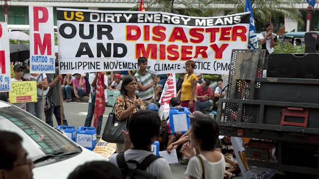 CUT CO2 EMISSIONS NOW. Climate justice advocates say cutting carbon emissions is a matter of life and death for disaster-stricken countries like the Philippines. All photos by Andrew Robles