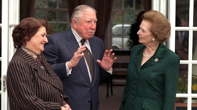 1999, March 26. Lady Thatcher (R) visits ex-Chilian President General Pinochet (C) and his wife at their temporary residence where the former dictator is under house arrest at Wentworth in Surrey. AFP Photo