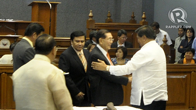 HIS SUCCESSOR? Resigned Senate President Juan Ponce Enrile approaches his likely successor Sen Frank Drilon after quitting his post. Photo by Rappler/Leanne Jazul