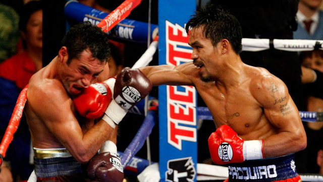 GOLDEN BOY. In 2008, an aggressive Manny "Pacman" Paquiao sent Oscar "Golden Boy" Dela Hoya to retirement. Photo by Ethan Miller/Getty Images/AFP