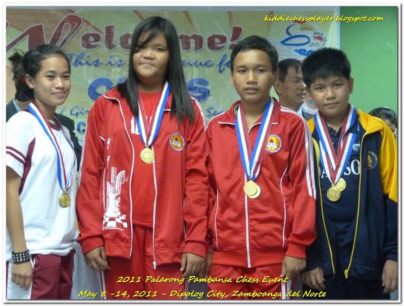 WINNERS. Marie Antoinette and Christian, in red jackets, both won Best in Board at last year’s Palaro. Included in this photo are Rowelyn Acedo and Daryl Samantila. From kiddiechessplayer.blogspot.com.