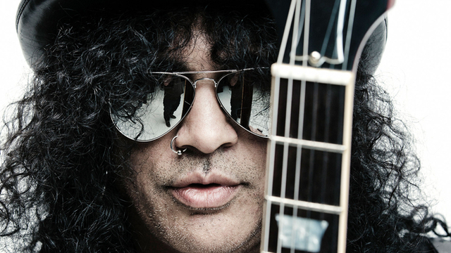 SHADES OF GREATNESS. The top hat, the shades, the long, curly locks — and blistering rock licks — will be upon us when Slash plays at the Smart Araneta Coliseum on May 4. Photo from www.q1021.fm