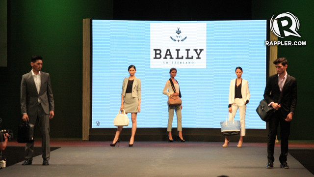 FAVORITE LOOK: SECOND FROM LEFT (WHITE HAND BAG). 'Power dressing' stretches far beyond blazers. Bally bags help create the professional attire.