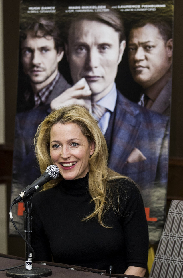 A ROSE AMONG THE... Anderson at an overseas press conference for ‘Hannibal,' with co-stars Hugh Dancy, Mads Mikkelsen and Laurence Fishburne virtually behind her 