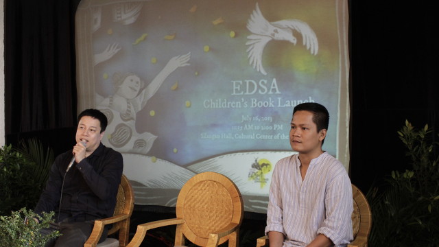 CREATORS. 'EDSA' children's book author Russell Molina and illustrator Sergio Bumatay III answer questions from the media during the book launch