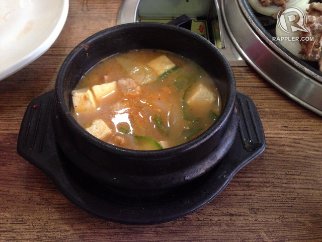 SPICY START. With blocks of tofu and chunks of pork, this soup comes free when you order two meat dishes