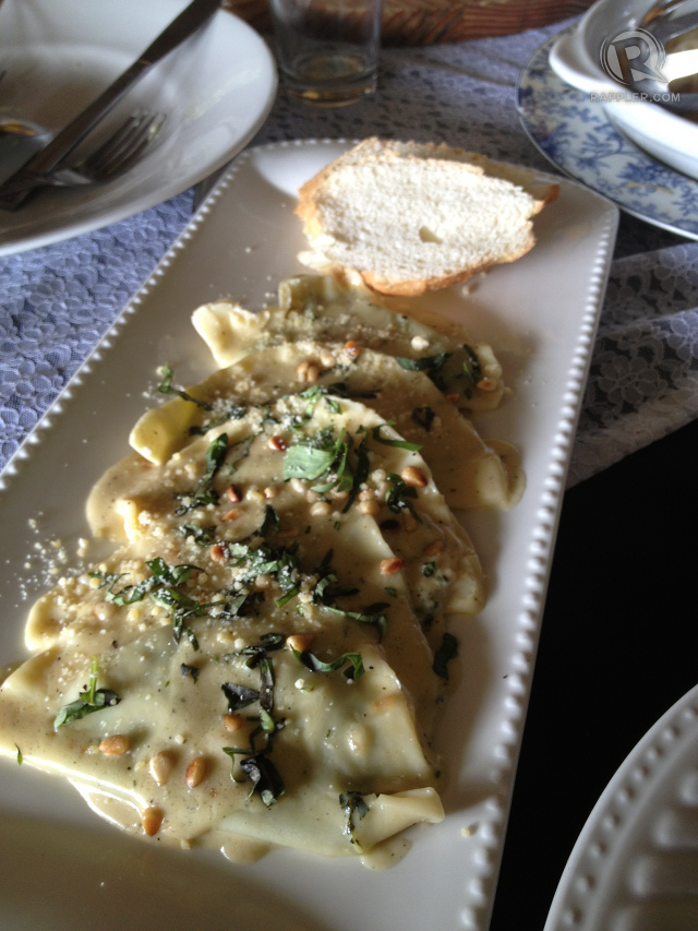 HOMEMADE RAVIOLI. It was stuffed with homemade ricotta and spinach,  topped with a creamy sauce with truffle oil, organic arugula and pine nuts