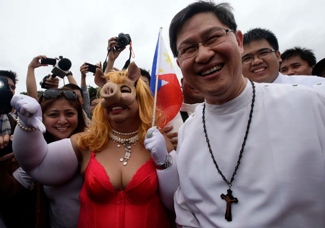 PORK. Mae Paner with Cardinal Luis Antonio Tagle. Photo by EPA/Dennis Sabangan