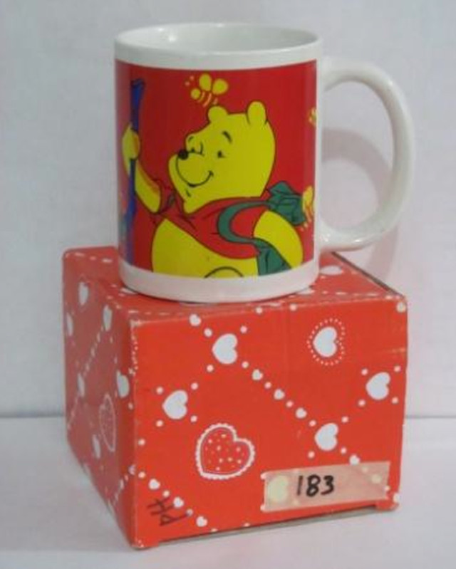 MUG. This sample of a mug with red and yellow Winnie the Pooh design with 11, 200 ppm of lead, 3,384 ppm of cadmium and 1,797 ppm of arsenic