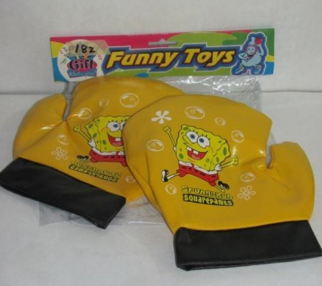 SPORTING TOY. This sample of a black and yellow 'SpongeBob SquarePants' PVC plastic boxing gloves with 9,356 ppm of lead