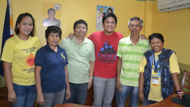 WITH CONSTITUENTS. Gullas (in red shirt) believes English-subtitled Filipino shows will improve Filipinos' proficiency in the language. Photo from samsamgullas.weebly.com
