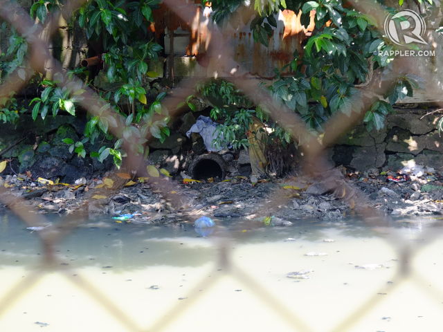 WASTE DEPOSITORY. Pipes, many connected to toilets, dump wastes straight into a creek in Paco, Manila