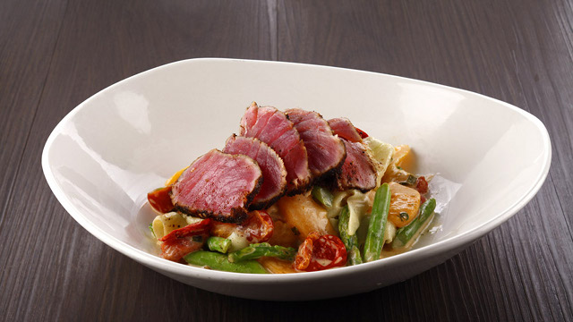 SUMMER SALAD. Refreshing combination of seared Ahi Tuna, cucumber slivers, roasted tomatoes, blanched asparagus and peaches