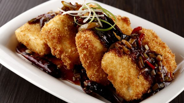 HEY, TOFU DETRACTORS. Tofu breaded with a crispy shell, fried until golden brown and served with a savory Kung Pao sauce with charred bell peppers and onions 