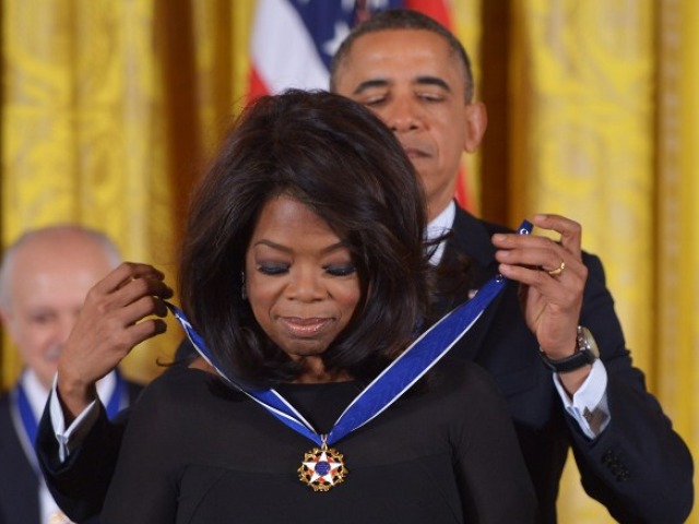 PRESIDENTIAL MEDAL OF FREEDOM. Oprah and other honorees represent 'what JFK understood to be the essence of the American spirit.' AFP PHOTO/Mandel NGAN