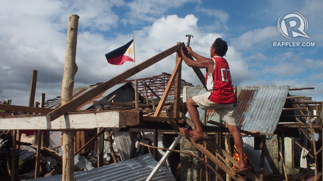 RISING FROM DISASTER. Communities in Eastern Visayas rebuild their homes and their lives after Typhoon Yolanda (Haiyan) brought the region to its knees. Photo by Jake Verzosa