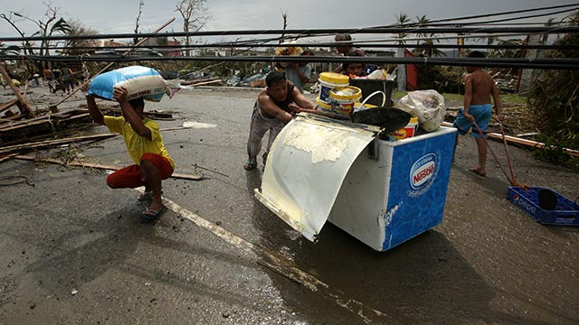 INFORMAL SUPPLY. Some typhoon victims continue to live on goods from ransacked grocery stores. Photo by EPA/Francis Malasig