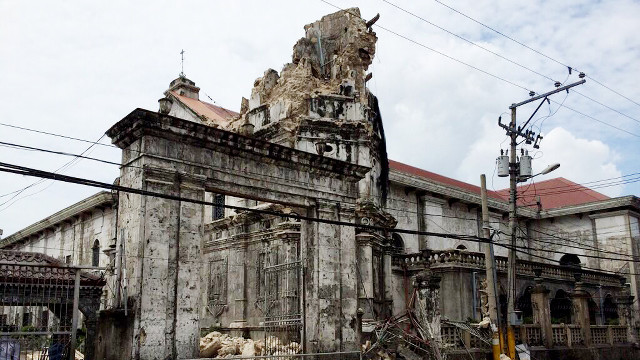 BROKEN. Tourist attractions like the historic Basilica Minore del Sto Niño in Cebu were heavily damaged by the Visayas earthquake last October. Photo by Jose Faruggia