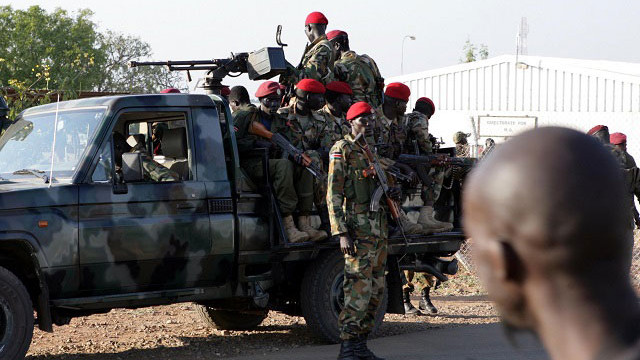 FIGHTING CONTINUES. South Sudanese soldiers on their vehicle patrol a street in Juba, South Sudan, December 20, 2013. Photo by Phillip Dhil/EPA