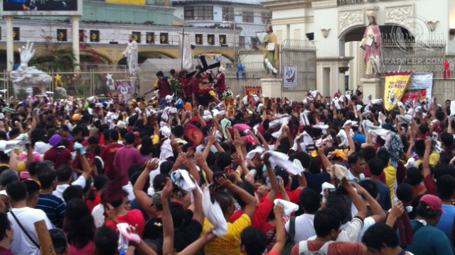 FAITH AMONG FRENZY. Devotees crowd the Plaza Miranda as they await the Black Nazarene's arrival during celebrations in 2013. Photo by Devon Wong