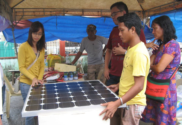 BRINGING LIGHT. Members of Project EnKindle unwrap a solar panel during a deployment to Tacloban City, Leyte. Photo courtesy of Project EnKindle