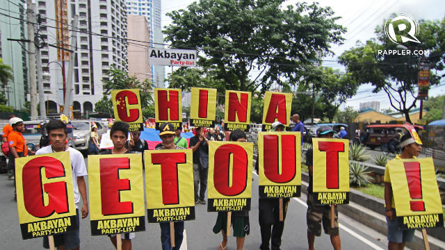 'CHINA GET OUT.' Hundreds of protesters troop to the Chinese consulate in July 2013 to denounce Beijing's 'bullying' over the West Philippine Sea. File photo by Vincent Go