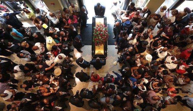 FAREWELL. The casket of Michael Brown is taken out of the church during the funeral services for Michael Brown at the Friendly Temple Missionary Baptist Church, St Louis, Missouri, USA, 25 August 2014. Robert Cohen/Pool/EPA
