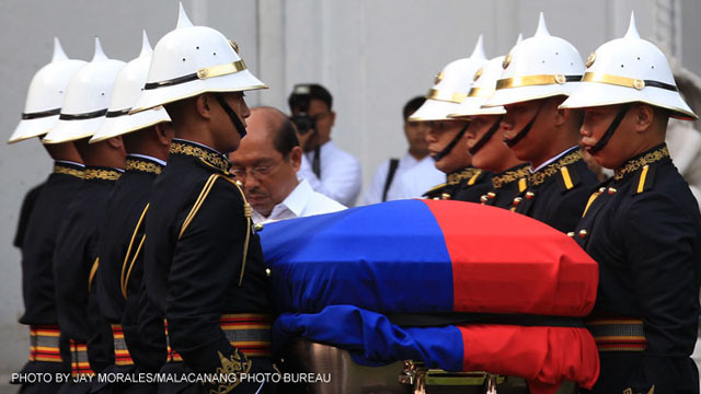 Members of the Presidential Security Group carried the coffin