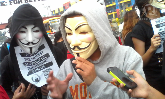 AWARE. Protester and Anonymous PH member NakedZnake said members of the group were all aware of the cyber attacks launched. Photo by Buena Bernal/Rappler