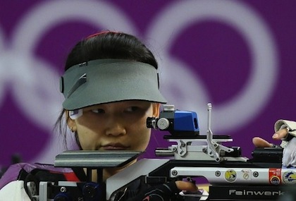Chinese athlete Siling Yi competes in the 10m air rifle women final at the London 2012 Olympic Games at the Royal Artillery Barracks in London, on July 28, 2012. Siling Yi took the gold medal. AFP PHOTO/MARWAN NAAMANI