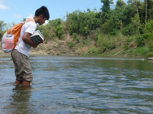 FOR THE SAKE OF LEARNING. Romnick crossed a bridgeless river to reach GreenEarth and learn English. Courtesy of GreenEarth Heritage Foundation.