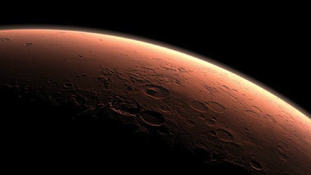 This computer-generated images depicts part of Mars at the boundary between darkness and daylight, with an area including Gale Crater, beginning to catch morning light. NASA/JPL-Caltech