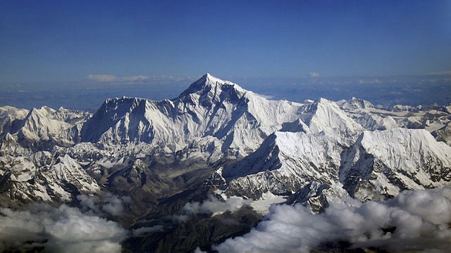 Mount Everest as seen from the aircraft of Drukair in Bhutan. The aircraft is south of the mountains, facing north. Photo courtesy of Wikipedia/Shrimpo1976