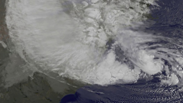 NOAA's GOES-13 satellite captured this visible image of Hurricane Sandy battering the U.S. East coast on Monday, Oct. 29 at 9:10 a.m. EDT. Sandy's center was about 310 miles south-southeast of New York City. Tropical Storm force winds are about 1,000 miles in diameter. Credit: NASA GOES Project