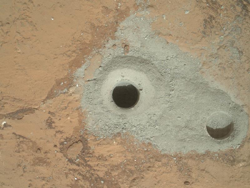 DRILL, BABY, DRILL. At the center of this image from NASA's Curiosity rover is the hole in a rock called "John Klein" where the rover conducted its first sample drilling on Mars. Image credit: NASA/JPL-Caltech/MSSS 