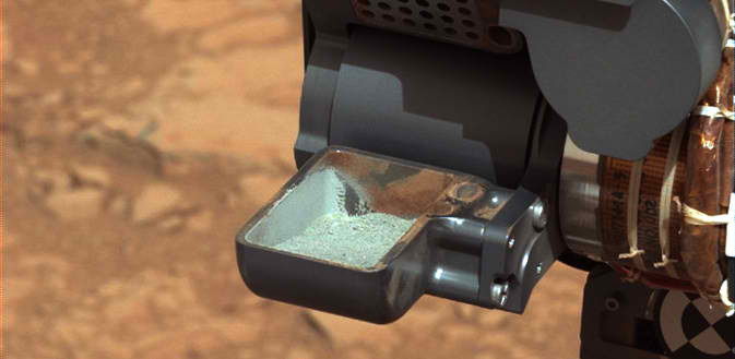 GRAY PLANET? This image from NASA's Curiosity rover shows the first sample of powdered rock extracted by the rover's drill. Image credit: NASA/JPL-Caltech/MSSS 