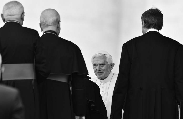 LAST GOODBYE. A black and white photo shows Pope Benedict XVI greeting priests and bishops on May 16, 2012 in Saint-Peter's square at the end of his weekly general audience. VINCENZO PINTO, AFP PHOTO.
