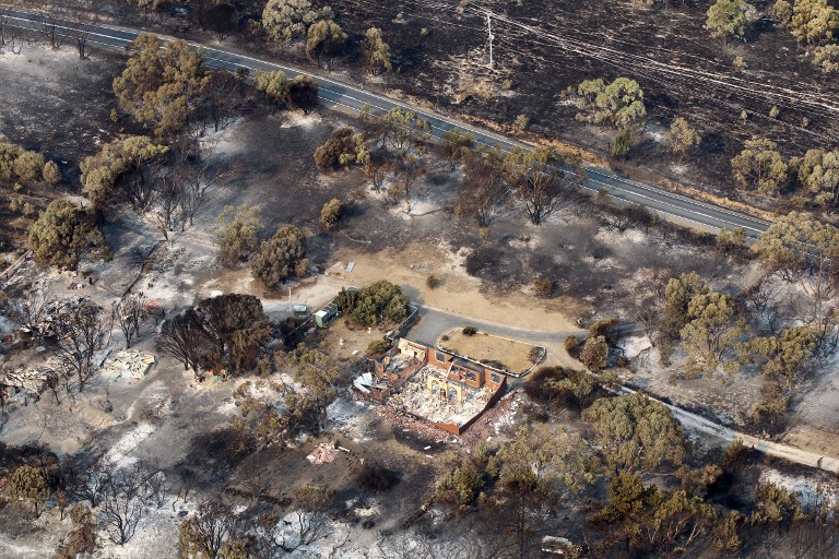 FIRE CASUALTY. This aerial photograph taken on January 5, 2013 shows the devastation to property between Dunalley and Boomer Bay after bush fires swept through the area. AFP PHOTO / POOL / Chris Kidd