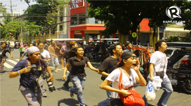 NATURALLY PROVOCATIVE? Youth activists run beyond the Mendiola Peace Arch in Manila. Photo by Rafael Ligsay